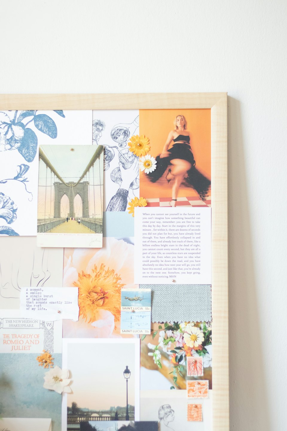 Mood board with photos, fabric swatches, and dried flowers.